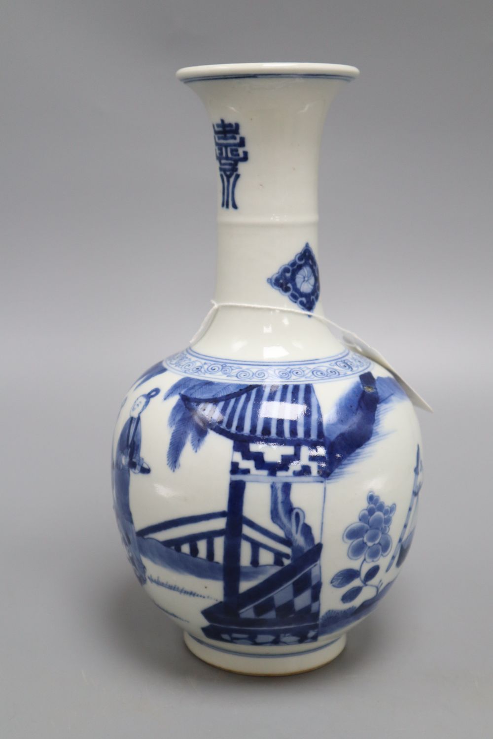 A Chinese blue and white figurative bottle vase, with four character mark to base, height 26cm